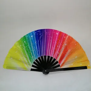 Detailed top view of rainbow folding fan with white stars pattern and black bamboo ribs