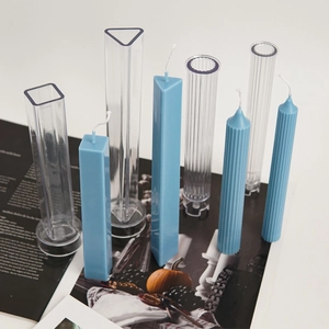 Detail view of geometric acrylic molds for DIY pillar candles with striped textures