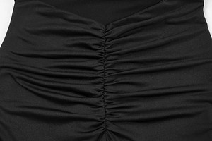 Detailed view of the elegant ruched design and pleated fabric on this black sexy dress