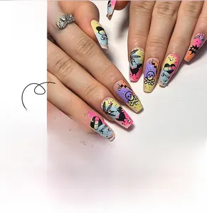 Close-up of long coffin press-on nails with street style graffiti skull and heart designs