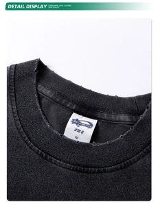 Macro shot of distressed neckline detail on 275g heavy cotton washed black vintage tee