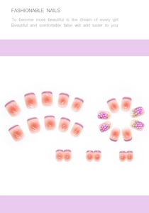 Detail of short almond press-on nails with purple gradient and 3D pearl accents