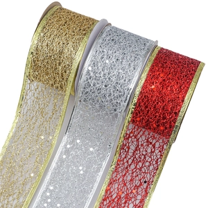 Three rolls of glittering Christmas wire mesh ribbons in gold, silver, and red festive colors