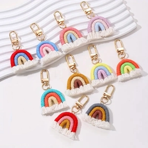 Set of 10 handmade macrame rainbow keychains with colorful cotton weaving and gold metal hooks