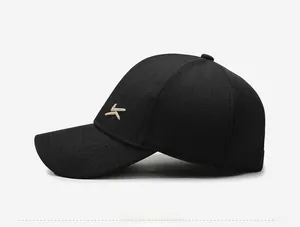 Detail view of the embroidered logo and fine stitching on the black men's baseball cap
