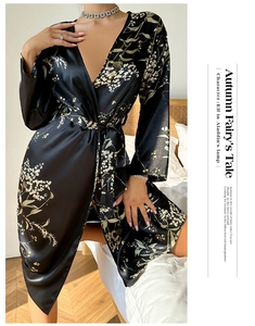 Detail of floral printed satin robe featuring classic waist tie and smooth silk texture