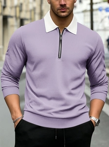 Detailed view of lavender waffle knit texture and silver metal quarter-zip on polo shirt