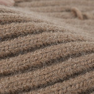 Brown distressed knit beanie with ribbed texture and soft mohair fibers for winter warmth