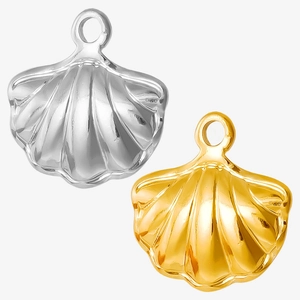 Macro shot of gold and silver stainless steel shell pendants with realistic 3D textures