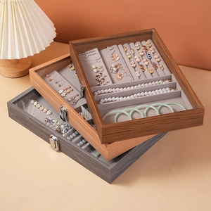 Three-tier walnut wood jewelry box with glass lids and velvet lining for rings and necklaces