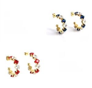 Detail of 18K gold plated C-shaped earrings with red and blue zircon inlay craftsmanship