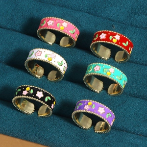 Set of six adjustable gold-tone flower rings with colorful enamel cherry patterns