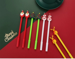Detail view of colorful Christmas cartoon gel pens with Santa, snowman and reindeer figures