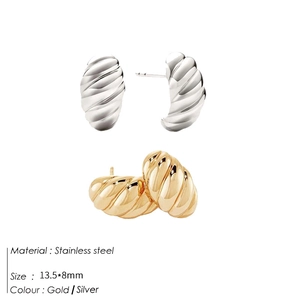 Detailed view of C-shape twisted croissant stud earrings in gold and silver stainless steel