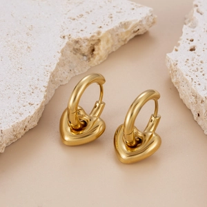 Minimalist gold plated stainless steel heart hoop earrings with a polished mirror finish