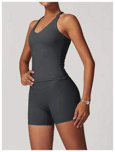 Close-up of cross back sports vest and high waist shorts set in dark gray matte fabric