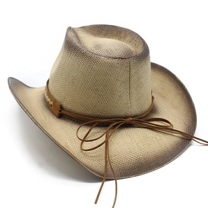 Detailed view of hand-painted straw cowboy hat with vintage brown gradient wide brim