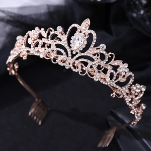 Close-up of rose gold bridal crown with crystal flower motifs and drop water rhinestones
