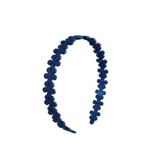 Detailed view of matte navy blue acrylic flower headbands with sweet floral pattern