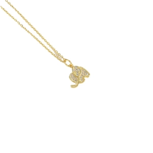 Elegant gold elephant pendant necklace with shimmering zircon stones on a white background