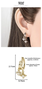 Detailed view of cubic zirconia star hoop earrings with dimensions 2.11cm by 0.74cm
