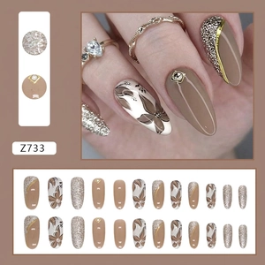 Macro detail of ballerina press-on nails with sparkling rhinestones and floral textures