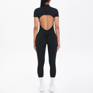 Rear view of black sports jumpsuit featuring a cut-out back and ruched butt lifting detail
