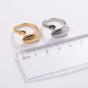 Minimalist adjustable oval rings in polished gold and silver finishes on white background