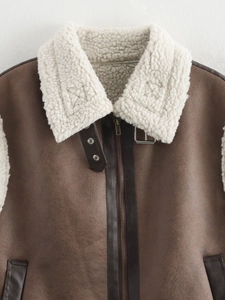 Detail of dark brown faux suede vest featuring a faux shearling collar and zipper closure