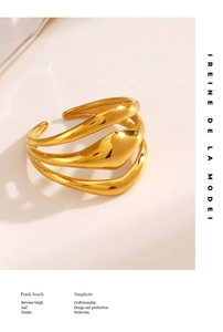 Detail view of multi-layer gold plated ring with polished organic wave lines