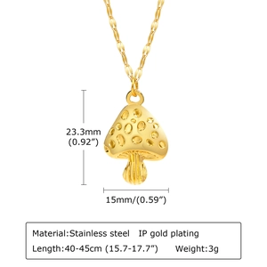 Macro detail of gold mushroom pendant showing IP plated stainless steel texture and dimensions