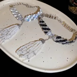 Luxurious Cuban chain choker with pavé rhinestones and pearl tassels in black and white