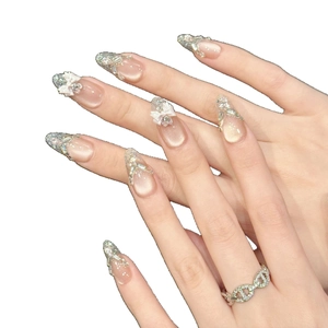 Pink cat eye almond press-on nails with silver glitter, bows and rhinestone accents