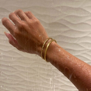 18k gold plated titanium steel bangles with zircons in a waterproof shower setting