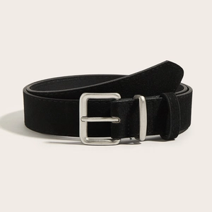 Close-up of black suede vintage waist belt featuring a matte silver buckle detail