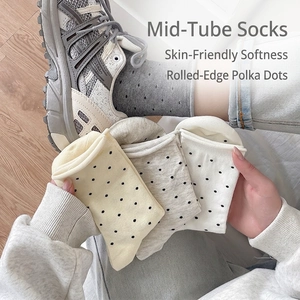 Cozy cotton mid-calf socks featuring retro polka dots and stylish rolled edges for women