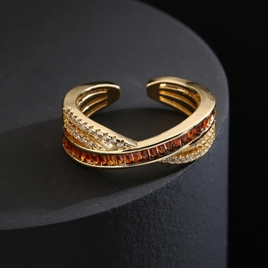 Luxurious gold crossover open ring with orange baguette zircon and white crystal accents