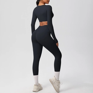 Detail view of black yoga set showing side pockets and brushed breathable high-stretch fabric