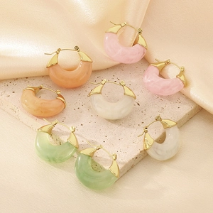 Detailed macro view of U-shaped marble resin earrings in pastel jelly colors