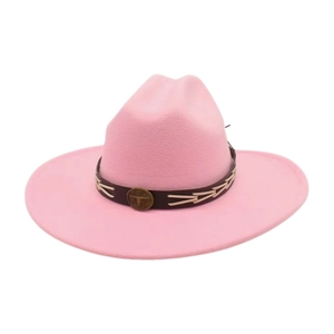 Detail of pink wool cowboy hat featuring a leather band with bull emblem and woven trim