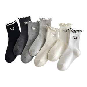 Set of 7 pairs of women's crew socks with ruffles and bow embroidery in neutral tones