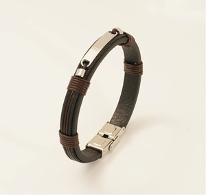 Detail of men's leather bracelet with steel plate and stainless steel folding clasp