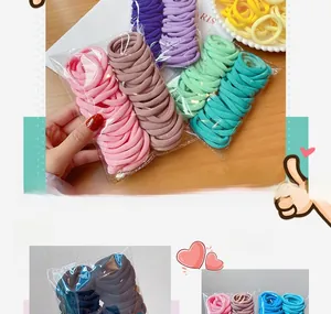 Detail of high-elasticity candy colored seamless hair ties in a bulk 50-piece pack
