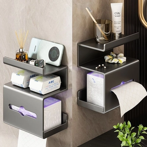 Wall-mounted dark grey metal shelf and tissue box holder for bathroom organization