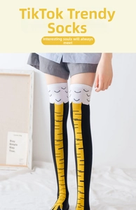 Close-up of over-the-knee socks with funny chicken leg patterns in black and yellow
