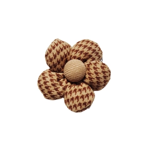 Brown and beige houndstooth fabric flower ornament with cotton filling and cream center