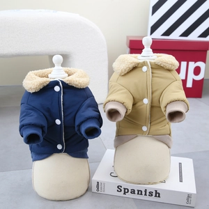 Close-up of thick winter pet coats with fleece collars and button closure for dogs