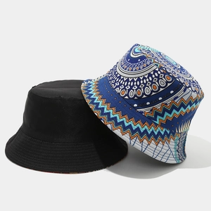 Detail of two bucket hats in black canvas and bohemian geometric patterns on white background