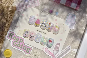 Close-up of cute 3D embossed nail stickers featuring kittens, fruit, and bow designs