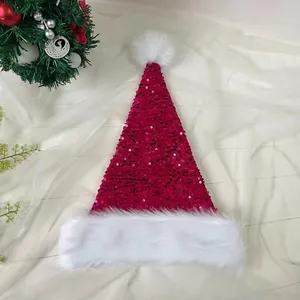 Detail of red sequined Christmas hat with white faux fur trim and pom-pom decor